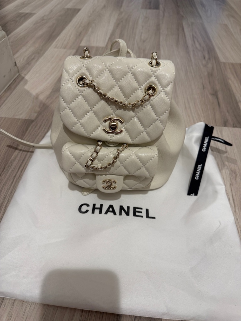 CHANEL Cream Quilted Leather Backpack with Gold-Tone Chain